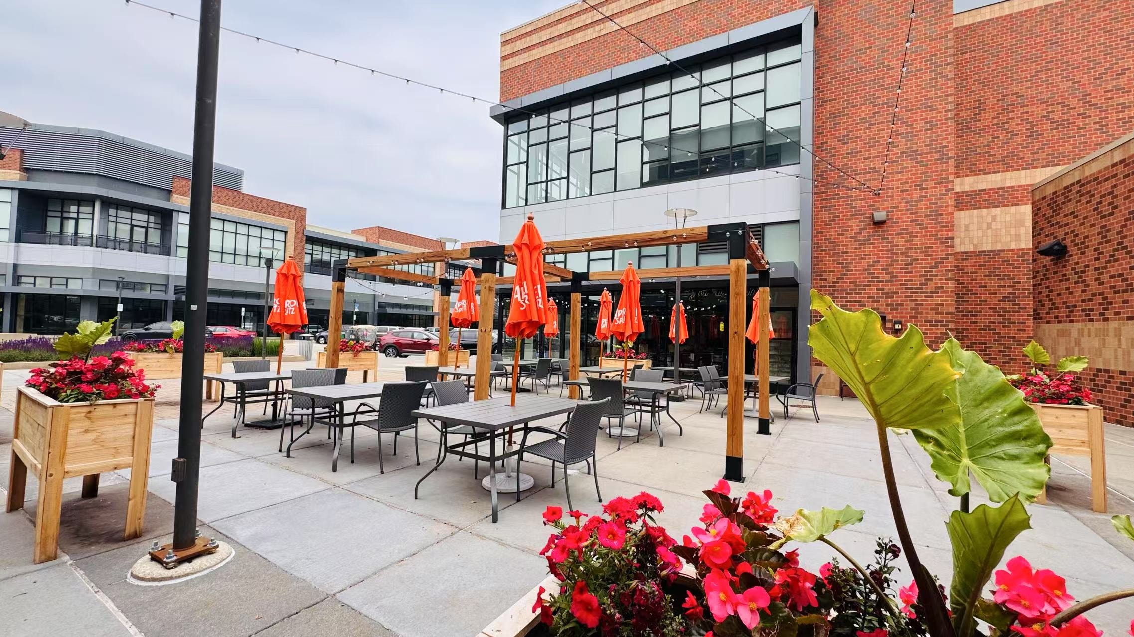 Outdoor patio dining with red umbrellas